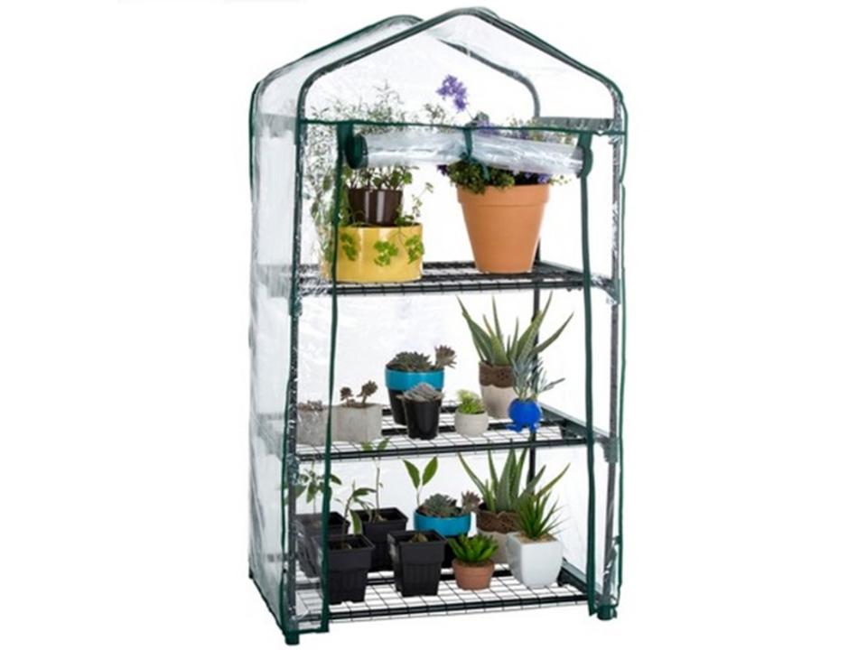 A 3-Tier Genesis Portable Rolling Greenhouse with plants inside