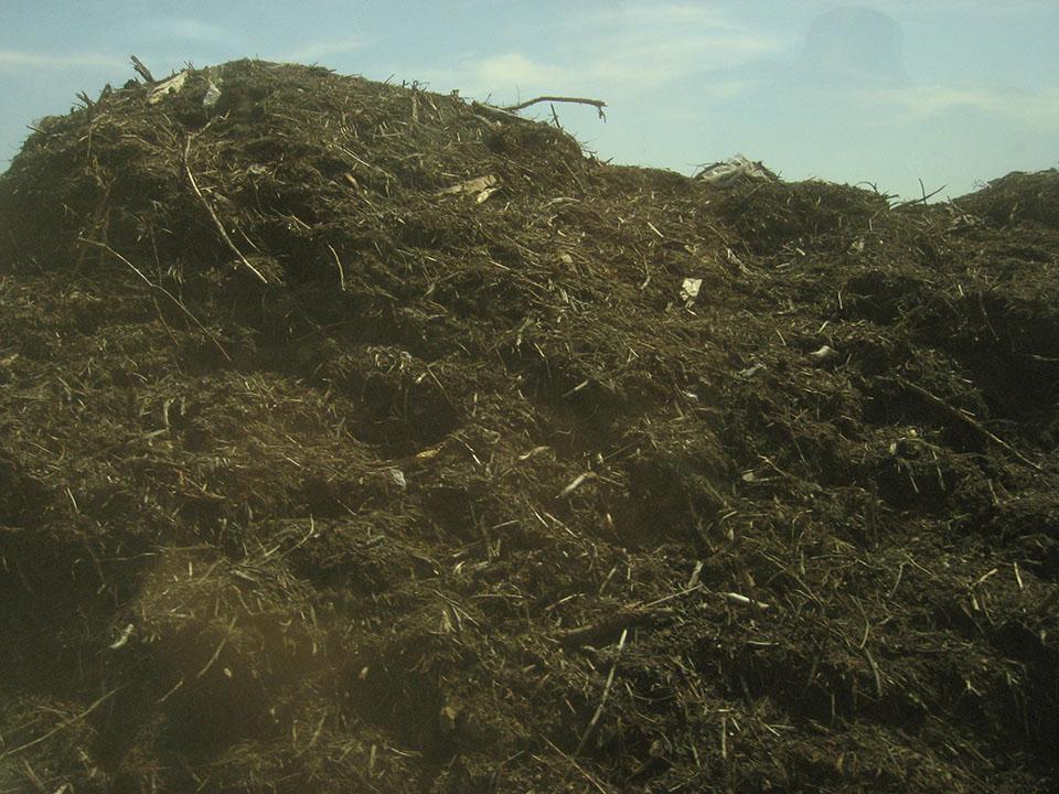 Huge pile of rich soil like compost