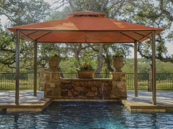 A pool under Kingsbury Gazebo with Rust Sunbrella Top