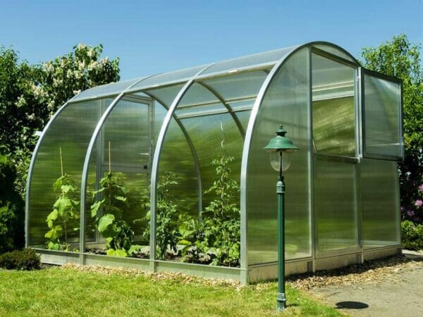 Side view of Arcus 3 Greenhouse - all three sections are opened - opened top section of the door