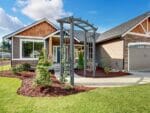 Dove Grey Athena Wooden Garden Arbor in front of the house