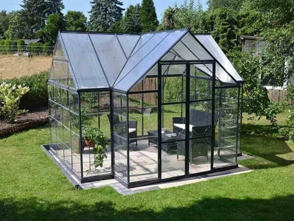 Palram Chalet 12ft x 10ft Hobby Greenhouse HG5400 - full view - in a garden