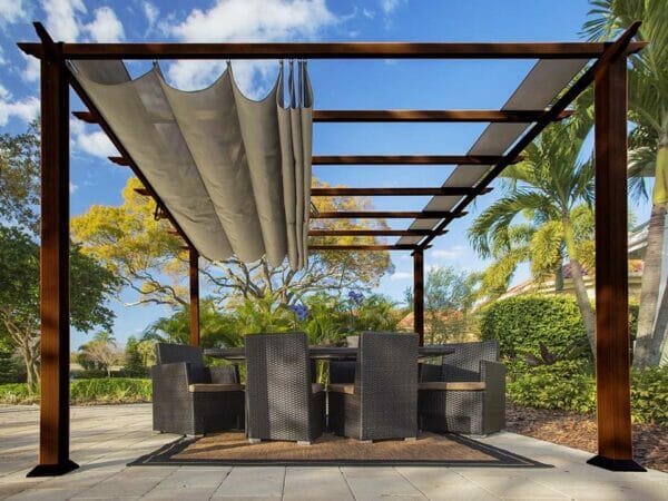 Florence Aluminum Pergola with the look of Chilean  Wood Grain Finish  and a Sand Color Convertible Canopy