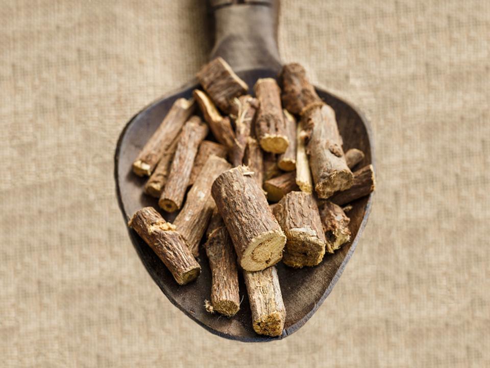 Licorice root on a wooden spoon