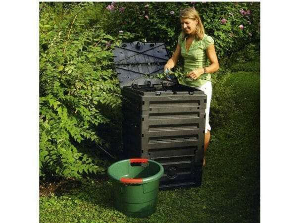 Eco Master 300 Compost Bin and a woman cutting the stem and putting it into the Bin.