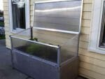 Grey Timber Raised Bed with Year Round Cold Frame by the House Fully Open ×