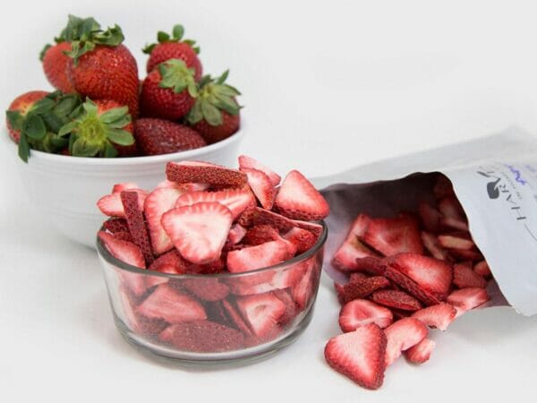 Frozen dried thin slices of strawberries in cups and in a Mylar bag.