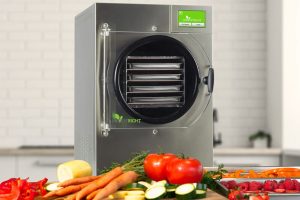 Small Harvest Right Freeze Dryer in Stainless Steel with produce in front