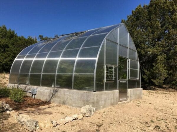 Hoklartherm Riga XL 9 Greenhouse 14x30 side view in a field set up