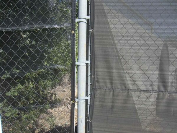 Close up look Riverstone Black Knitted Shade Cloth as a privacy fence