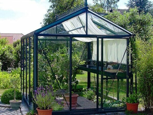 Janssens Royal Victorian VI23 Greenhouse exterior view highlighting one piece vertical glass, shade clothes in use, door open