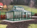 Green Janssens Cathedral Victorian Greenhouse 15ft x 20ft in a garden, empty, door open, front view