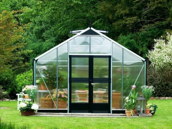 Juliana Gardener Greenhouse 12ft x 19ft - 10mm Polycarbonate - front view - in a garden