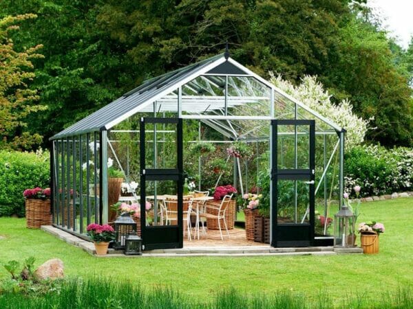 Juliana Gardener Greenhouse 12ft x 19ft - 3mm toughened glass - front view - in a garden