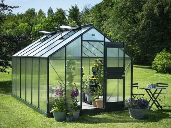 Juliana Junior Greenhouse 9ft x 14ft - Anthracite 6 mm Polycarbonate - open door - open roof vents - front view - in a garden