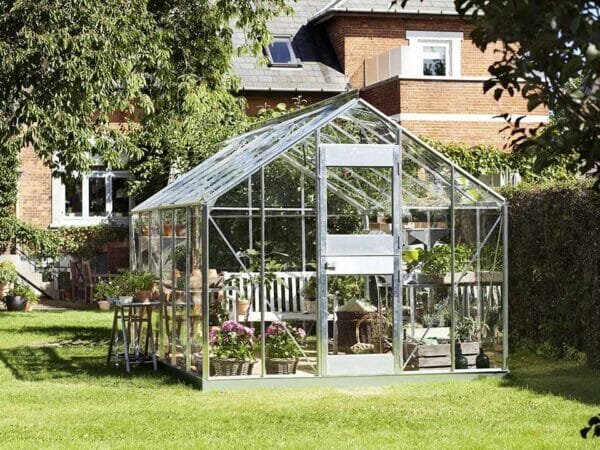 Juliana Junior Greenhouse 9ft x 14ft - Aluminum 3 mm Horticultural Glass - open double hinged door - in a garden