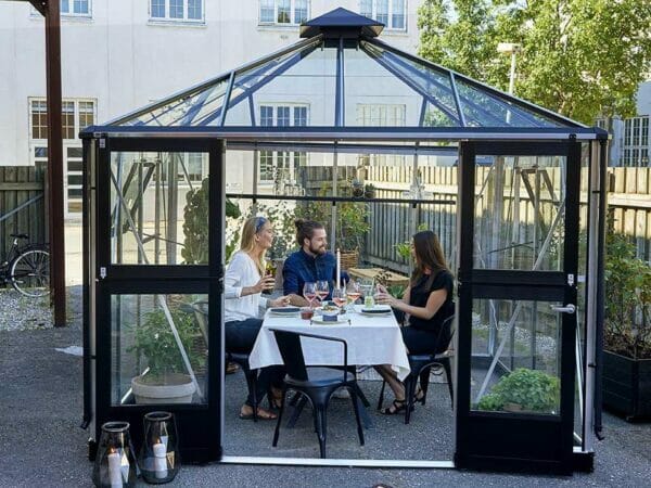 Juliana Oasis Greenhouse 10ft x 10ft Aluminum with three people inside