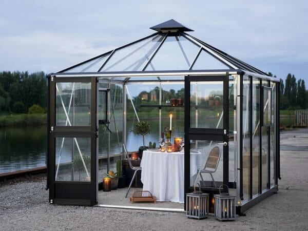 Juliana Oasis Greenhouse 10ft x 10ft Aluminum with a table for two inside