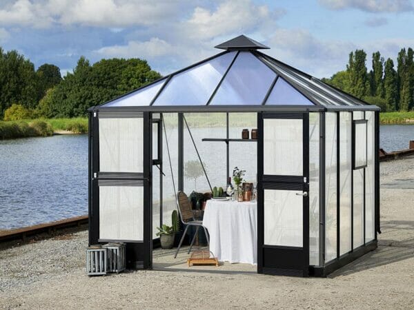 Juliana Oasis 10x10 Polycarbonate with a small dining set up inside