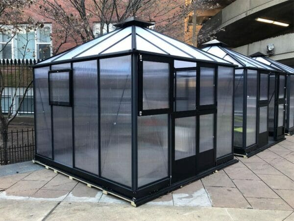 Bare Juliana 10x10 Polycarbonate with open left upper door. It is showing its front and side views with closed side window
