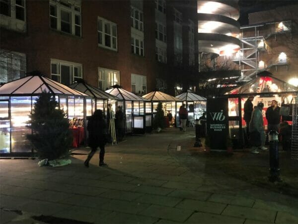 Several Juliana Oasis 10x10 Polycarbonate used as mini stores in a Christmas fair