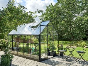 Side view of the Juliana Qube Greenhouse 7ft x 11ft with open sliding door