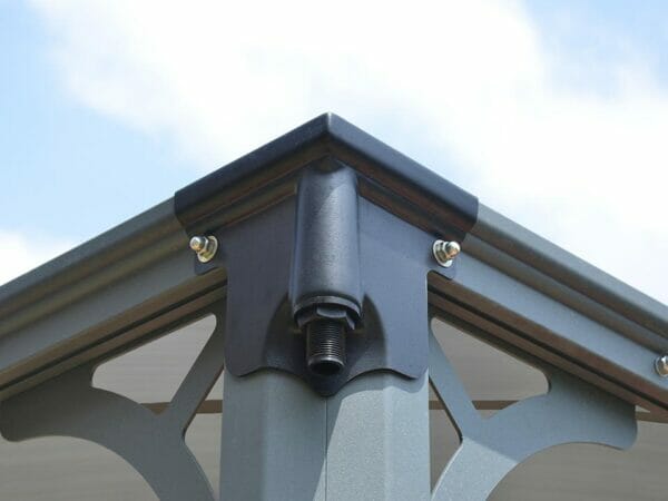 Corner view of Martinique Hard Top Gazebo with a downspout