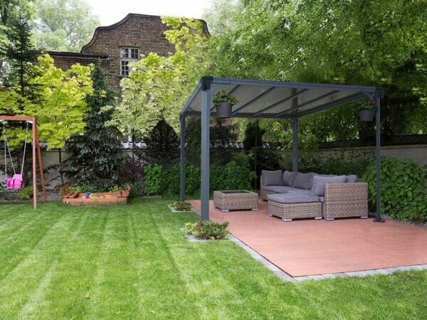 Milano 3000 10ft x 10ft Hard Top Gazebo with a living room set up in a garden