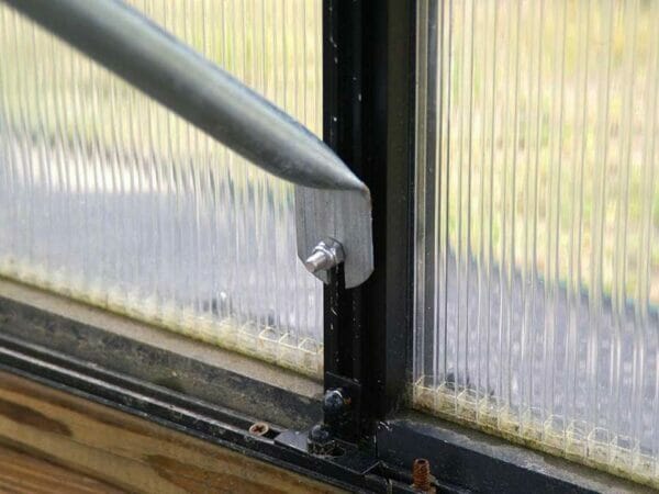 Close up of the Monticello Work Station Kit hinged leg in glass background