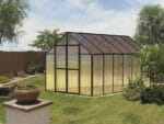 Riverstone MONT Greenhouse 8x12 with black frame in a garden