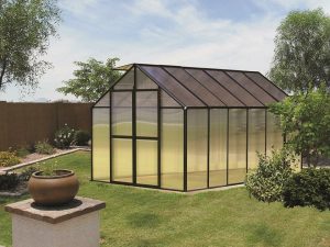 Riverstone Monticello Greenhouse 8x12 with black frame in a garden