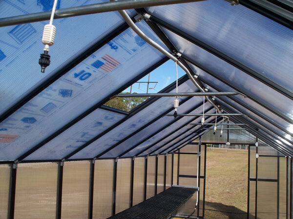 Programmable watering system (installed on the peak) inside a MONT Premium greenhouse