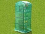 Genesis Portable Rolling Greenhouse with closed opaque cover and plants inside placed on a garden