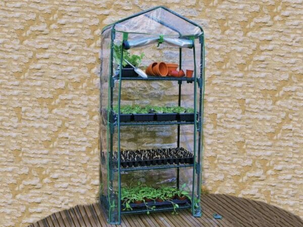 Genesis Portable Rolling Greenhouse with open clear cover and plants and pots inside
