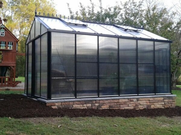 Janssens Royal Victorian VI34 Greenhouse 10ft x 15ft with polycarbonate covering on a stem wall