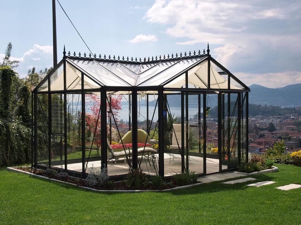 Janssens T-Shaped Royal Victorian Orangerie 10ft x 16ft in a garden with great view of mountains and a lake