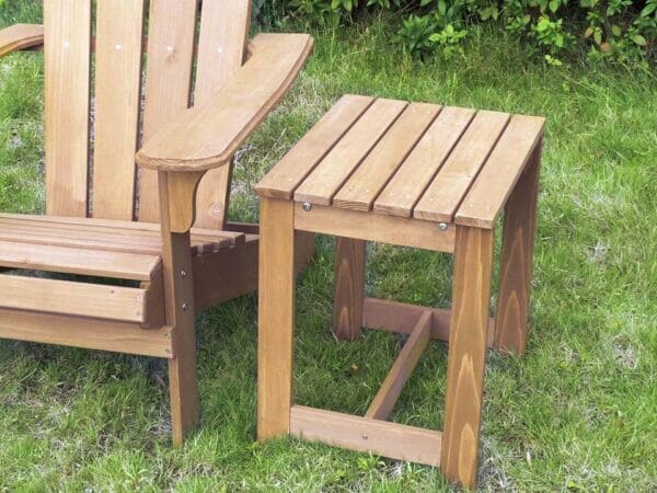 Wooden utility Side table beside an adirondack chair
