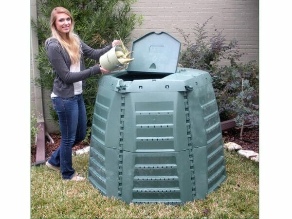 A woman on the left side pouring dried corns into the Thermo Star Jumbo Composter