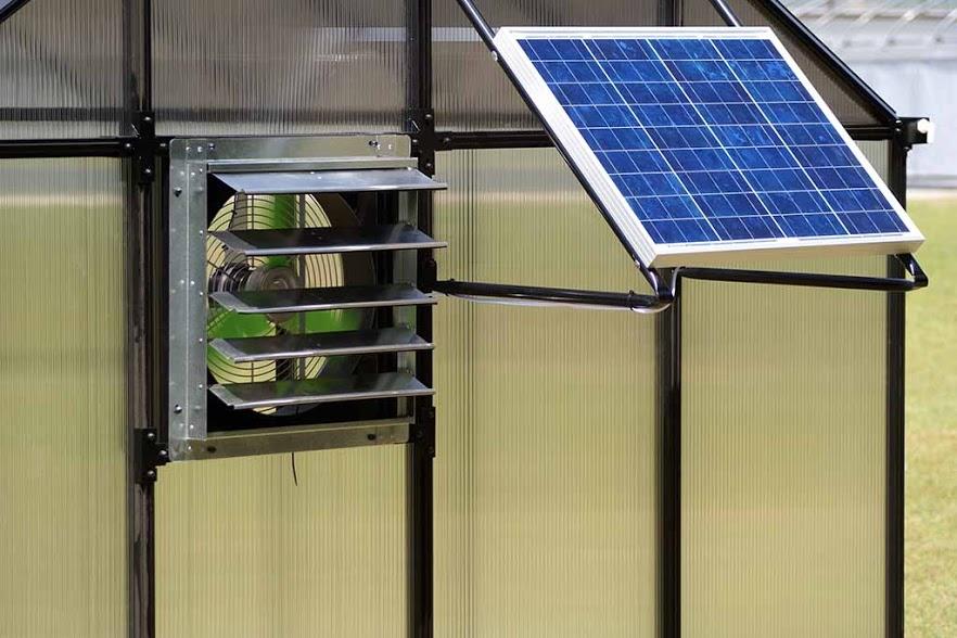 A solar powered fan on a greenhouse