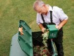 Easy to Use. Man pouring organic materials into the Aeroquick Composter