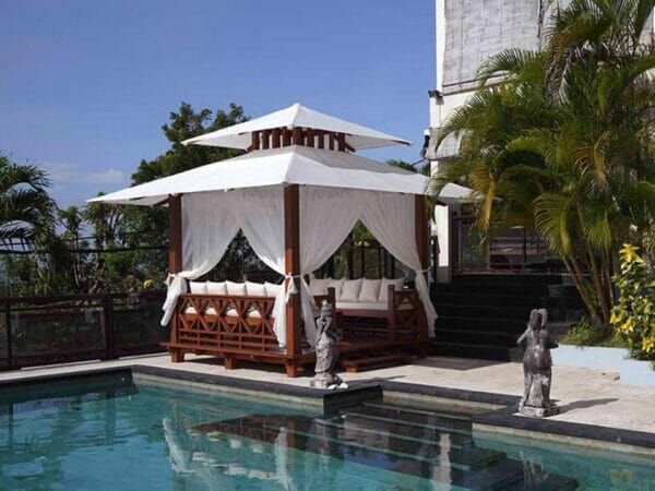Front and side view of Handcrafted Balinese Solid Wood Gazebo by the pool