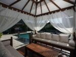 Interior view of Handcrafted Balinese Solid Wood Gazebo with bench and coffee table