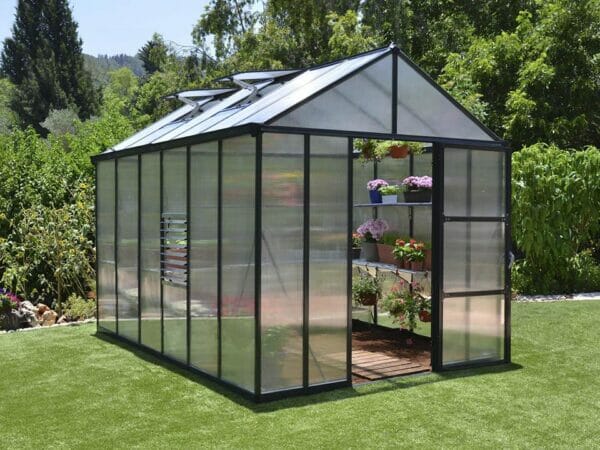 Palram Glory Greenhouse with black framework and Polycarbonate glazing in a garden