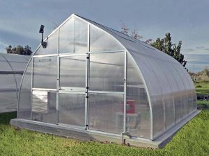 Hoklartherm Riga XL 6 Greenhouse 14x19 front view set up in a field