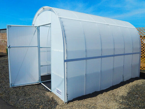 Side view, arched greenhouse, door open, vent visible in lower front corner