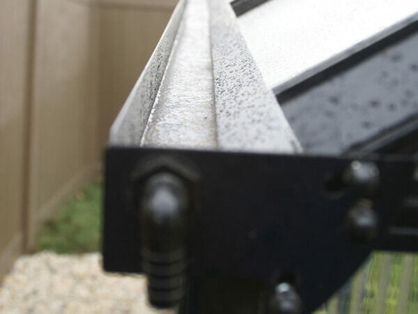 Gutter (water collection system) of the MONT Greenhouse with a pipe connector for a downspout