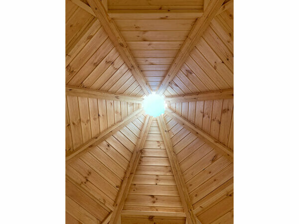 The ceiling of the octagonal Pyramid Grill House with a chimney opening in the center