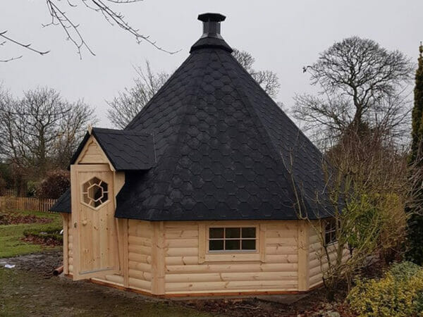 View of the octagonal wooden Pyramid Grill Cabin with bitumen shingles
