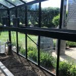 Janssens Seed Tray Shelf in Black installed in Greenhouse