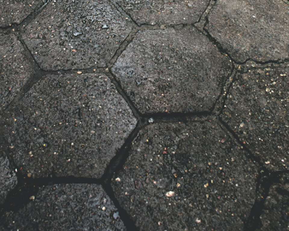 Poorly drained concrete pavers with standing water